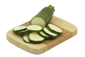 sliced zucchini on a wooden cutting board