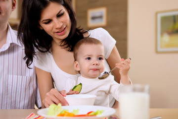 young family at home having meal