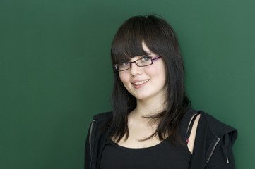Young Student at blackboard.