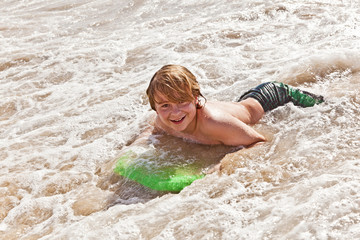 boy has fun with the surfboard