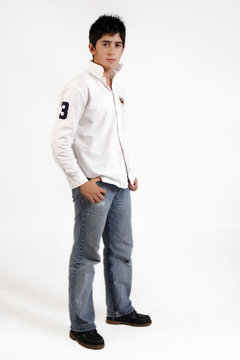 teenage boy in jeans and white shirt