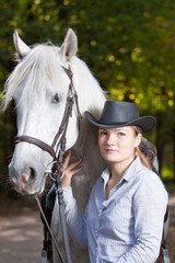 Young Lady hugging her horse