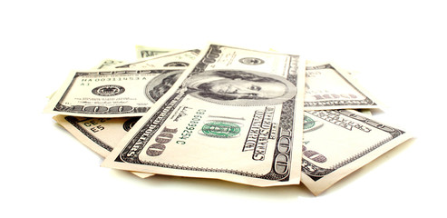 Many hundred dollar banknotes isolated on white