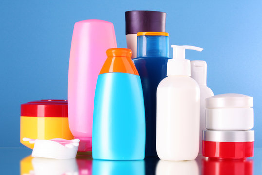 bottles of health and beauty products on blue background