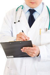 Medical doctor making notes in document. Close-up.