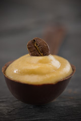 shallow coffee mousse in a chocolate spoon