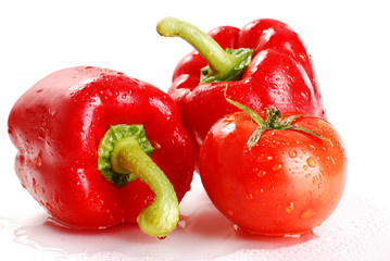 Peppers and tomato isolated on white