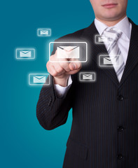 Man pressing e-mail icon