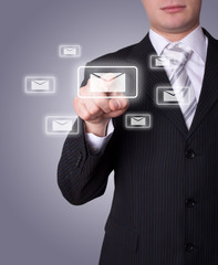 Man pressing e-mail icon