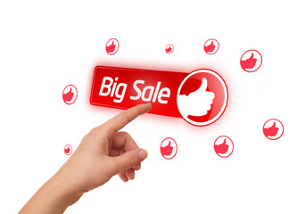 hand pressing big sale button