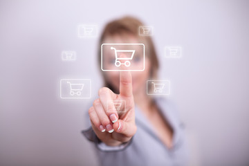 Woman pressing mdoern shopping button with one hand