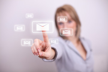 Woman pressing email envelope with numbers button