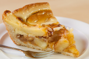 fresh apple pie on a white plate