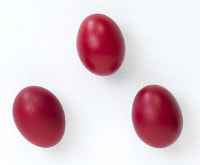 three red eggs for easter celebration