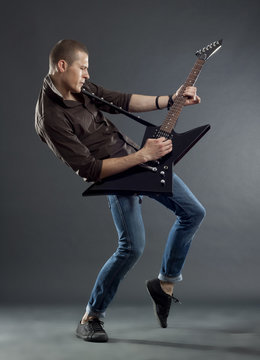 guitarist playing his electric guitar