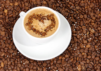 coffee mug against the backdrop of coffee beans