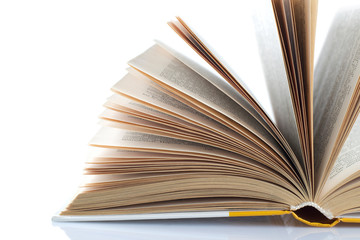 Open old book on white background. Isolated.