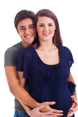 Mom and dad holding pregnant belly isolated on white