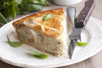 A portion of potato pie with basil