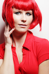 Beautiful woman posing in red dress.