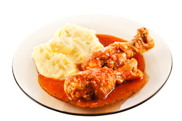 Dish with drumsticks and mashed potatoes