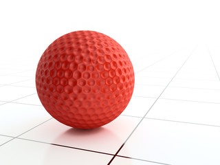 Red golf ball on checkered surface