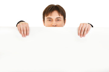 Man holding blank billboard isolated on white.