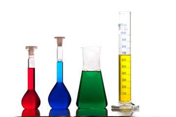 Labolatory glassware with colorful fluids isolated on white