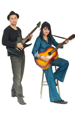 Couple playing guitars