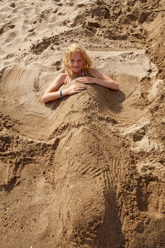 Girl Buried Under Sand