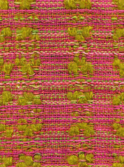 Close up detail of handwoven shawl in pink and green