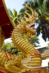 Fototapeta premium Naga or Nak statue infront of Buddhist church