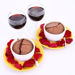 Chocolate soufflés,with rose petals and red wine for two