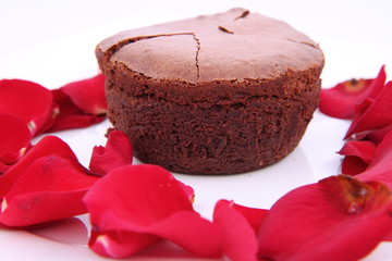 Chocolate soufflé decorated with red rose petals