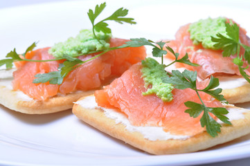 smoked salmon with wasabi  on cracker isolated