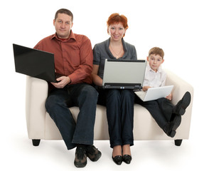 dad mom and son with laptop