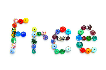 glass bead text spelling Free, on white