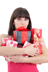 embarrased young girl with heaps of presents