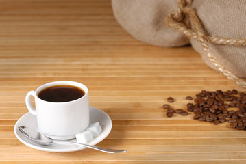 Coffee cup and roasted beans