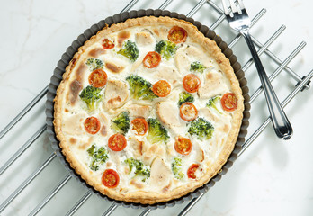 cake with broccoli, cherry tomatoes and chicken meat