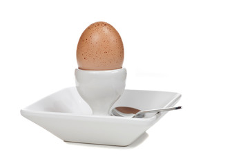 Boiled Egg in Dish with a Spoon
