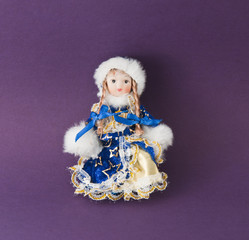 The Christmas Toy on purple background