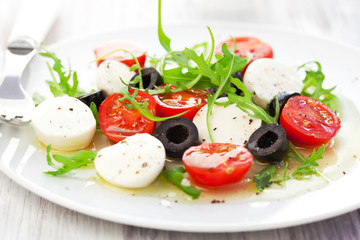 salad with mozzarella, tomatoes and black olive