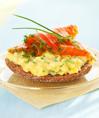 toast with scrambled eggs,salmon and chives