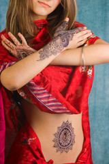 girl in a red sari and tattoos on his body