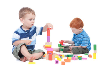 Boys playing with toy blocks