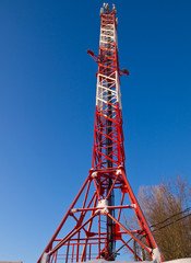 Cellular tower in sunny winter day