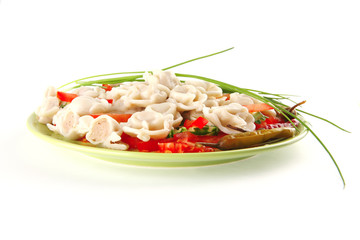 dumplings served with vegetables on green