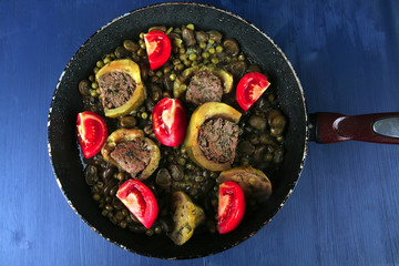 homemade cuisine: zucchini filled meat cooked with tomatoes
