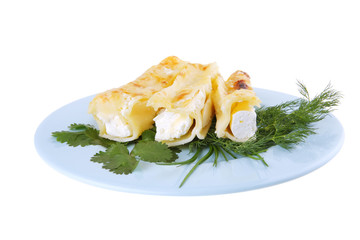 cheese cannelloni on blue plate